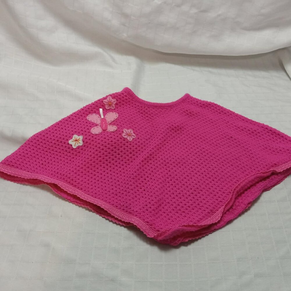 Pretty acrylic cape with flower decorations and a felt butterfly 2005, 12 months